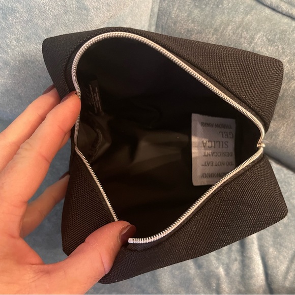 Dior black “CD” raised emblem silver & pearl wristlet & carriage keychain